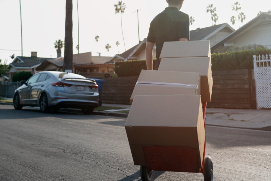 Delivery person getting parcel out for delivery